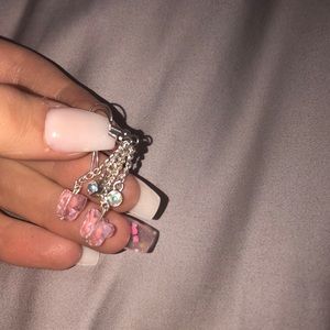 Pink butterfly with small holographic crystal